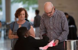 Usher helping guests with their tickets